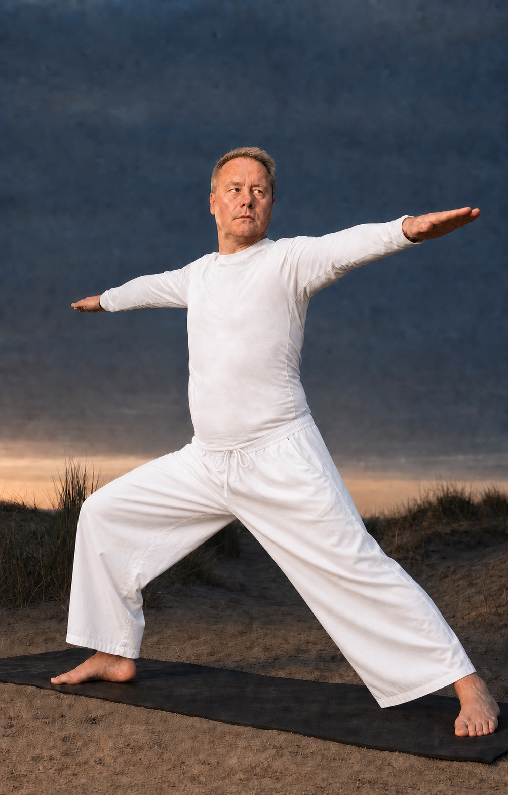 A stylised portrait of Raj practicing Warrior II among the dunes at blue hour